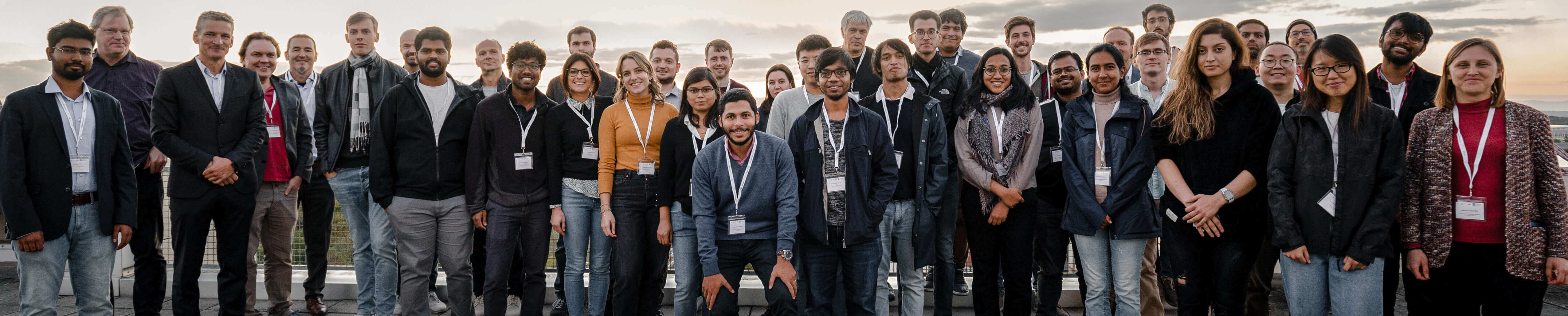 Group photo of the QUSTEC fellows a group of young people on a rooftop