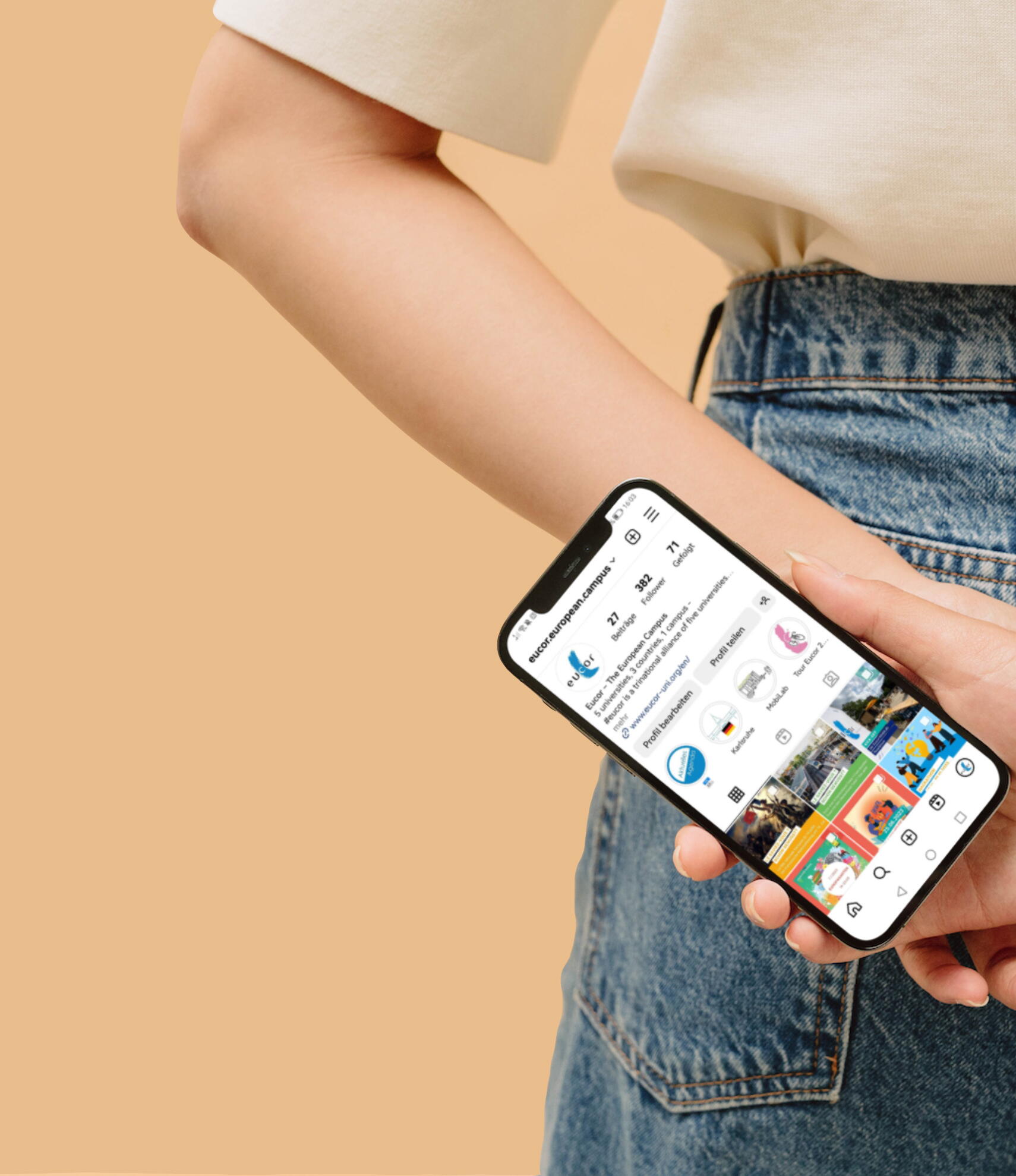 A woman holds her smartphone behind her back